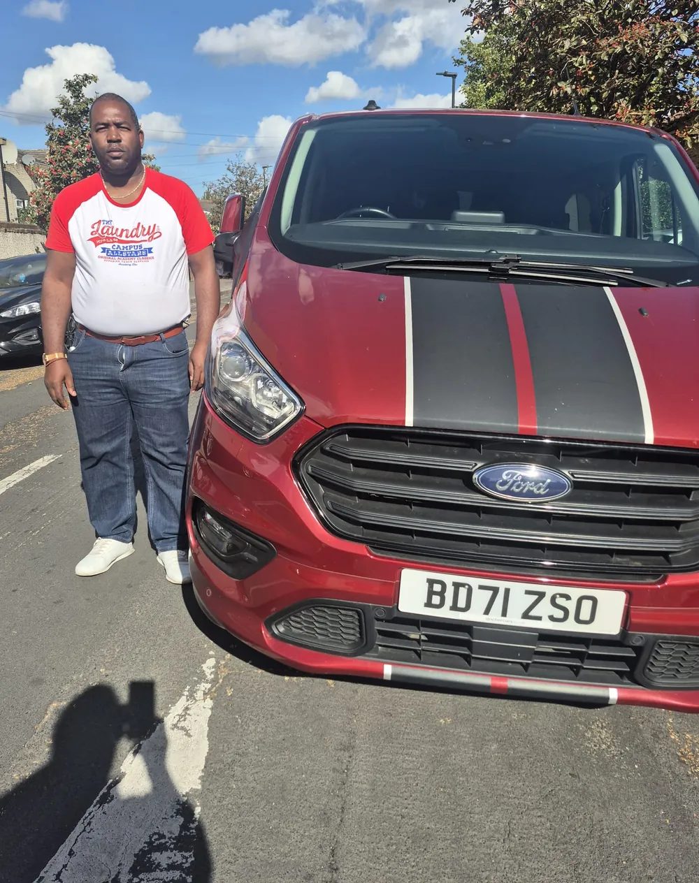 The Othalias Removals driver standing beside the company van